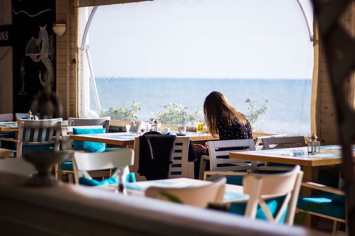 sitting in the cafe and facing the sea
